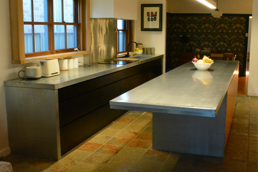 Custom made kitchen With cantilever zinc bench top. Custom made joinery and cabinet making