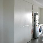 Custom made pantry with by-fold doors. Custom made joinery.