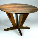 Intersection Round Dining Table. Made from Black Walnut with it’s straight lines and angles give it a dynamic solid look for the base. Versatile enough for use as a foyer round or bar table. Custom made timber furniture. Custom made furniture and furniture maker.