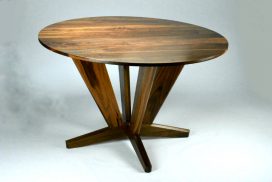 Intersection Round Dining Table. Made from Black Walnut with it’s straight lines and angles give it a dynamic solid look for the base. Versatile enough for use as a foyer round or bar table. Custom made timber furniture. Custom made furniture and furniture maker.