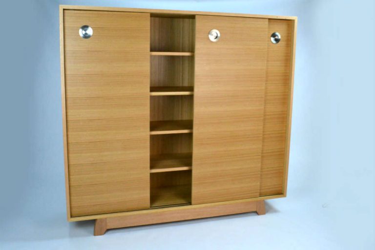 Custom made for a customer to store DVD. Made with sliding doors for easy access. Would be a great addition to any living room or hallway. Custom made timber furniture. Custom made furniture and furniture maker.