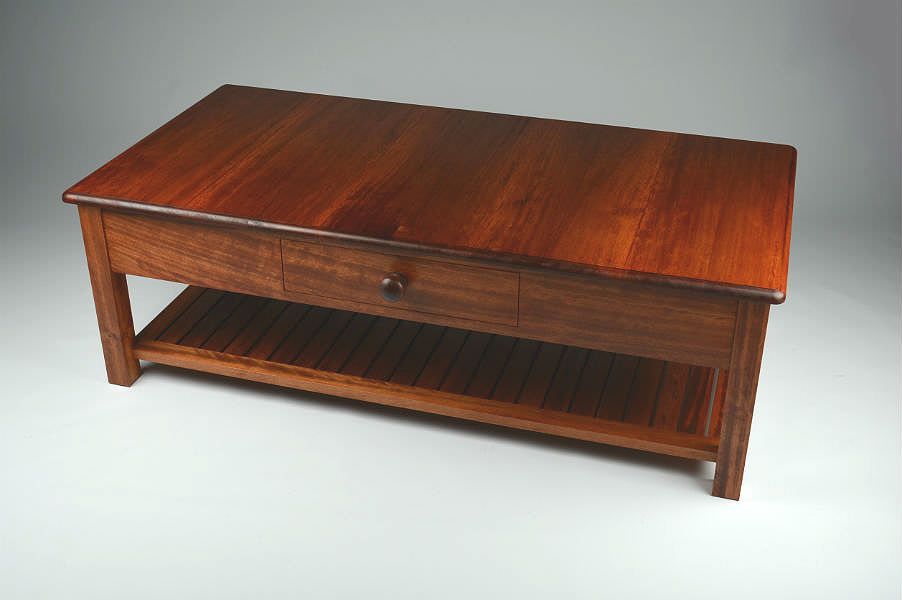 Stained Coachwood Coffee Table. A coffee table commissioned by the Thales Group for a Royal Australian Navy warship. Made in a traditional style and craftsmanship. Custom made timber furniture. Custom made furniture and furniture maker.