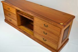 Australian Red Cedar and New Guinea Rosewood Entertainment Cabinet. Made in the traditional style with hand cut hounds dovetails draws. Decorated inlayed motifs and stringing. All solid timber construction with raised panels and secret compartments. Custom made timber furniture. Custom made furniture and furniture maker.