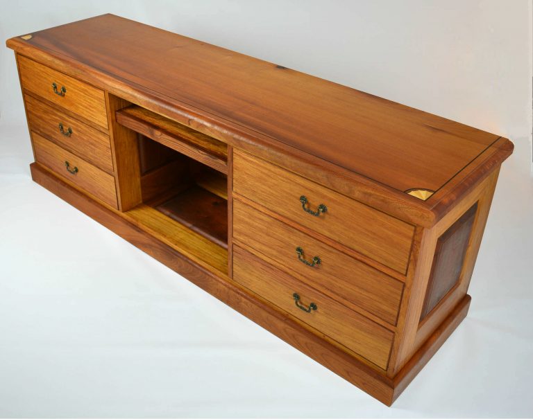 Australian Red Cedar and New Guinea Rosewood Entertainment Cabinet. Made in the traditional style with hand cut hounds dovetails draws. Decorated inlayed motifs and stringing. All solid timber construction with raised panels and secret compartments. Custom made timber furniture. Custom made furniture and furniture maker.
