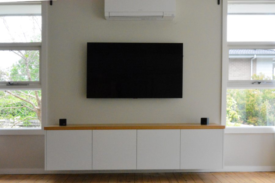 Custom made entertainment unit made for a customer in Beecroft. White oak top finished in white satin poly paint.