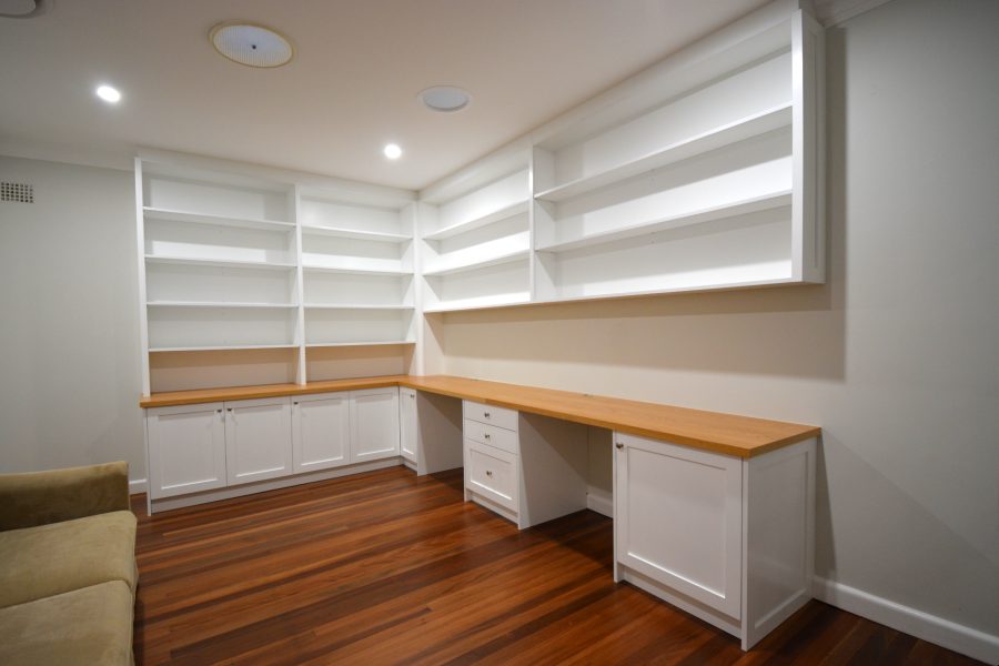 This two-seater home office with built-in bookcases was built for a customer in Pymble with shaker-style doors and timber oak benchtop. Finished in satin white ploy paint with clear satin on the bench top using Blum hinges and draw runner.