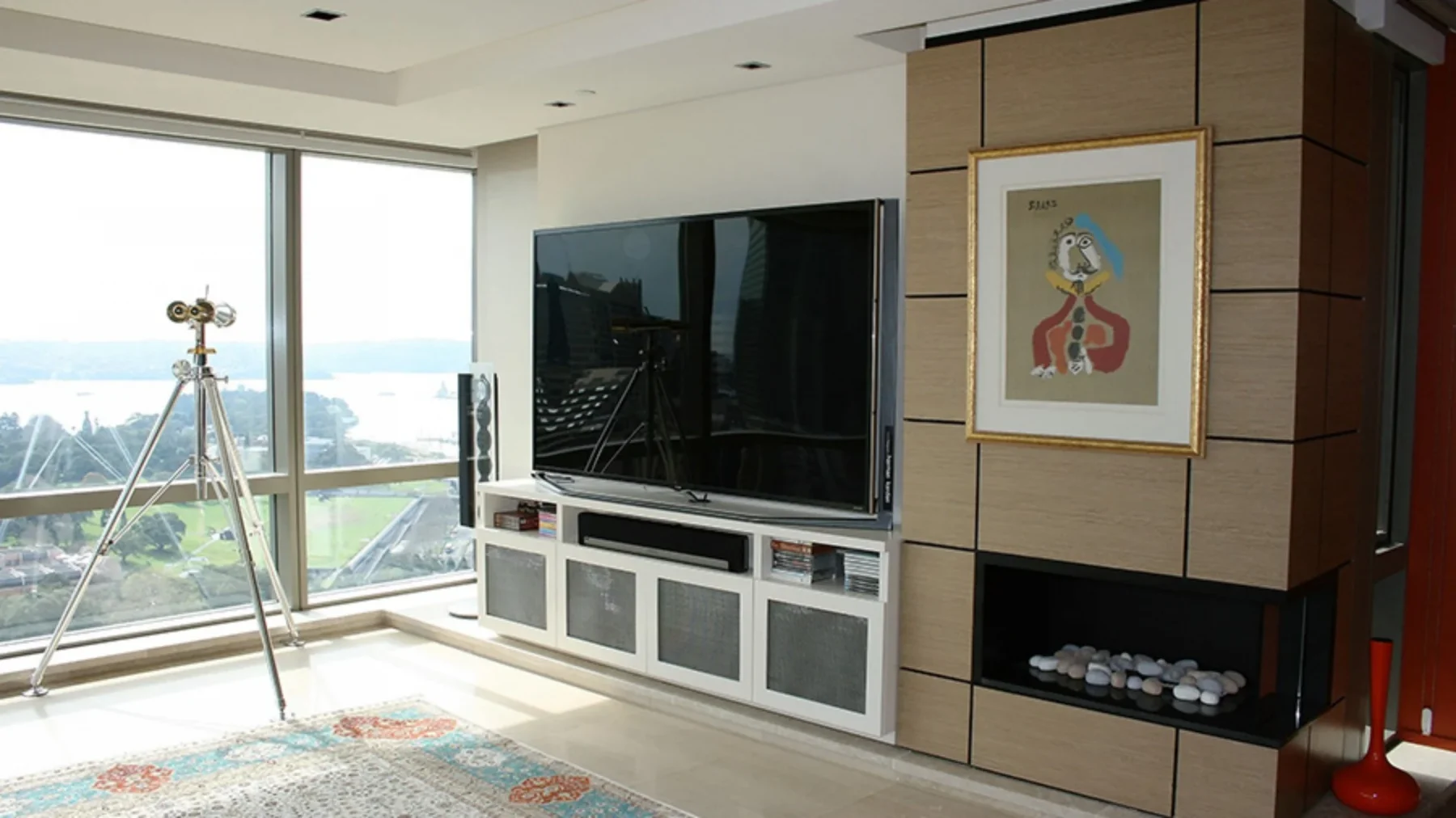 Custom-made Entertainment unit in Sydney CBD. Poly is painted in vivid white with shaker-style doors. Custom-made joinery and cabinet making.